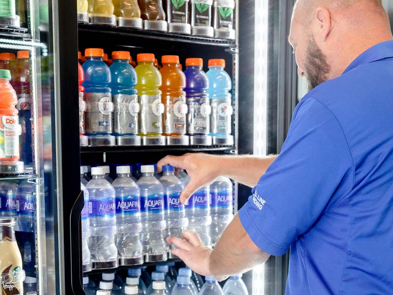 Man loading water bottles