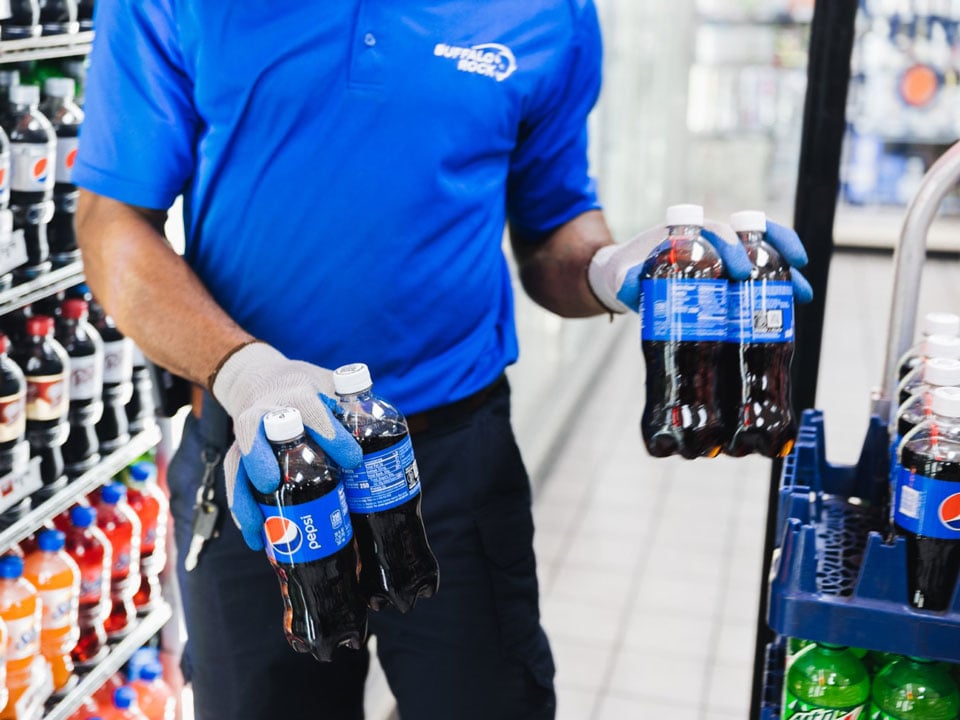 Man restocking drinks