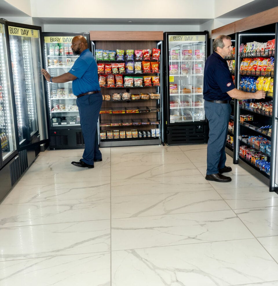 Employees stocking a market