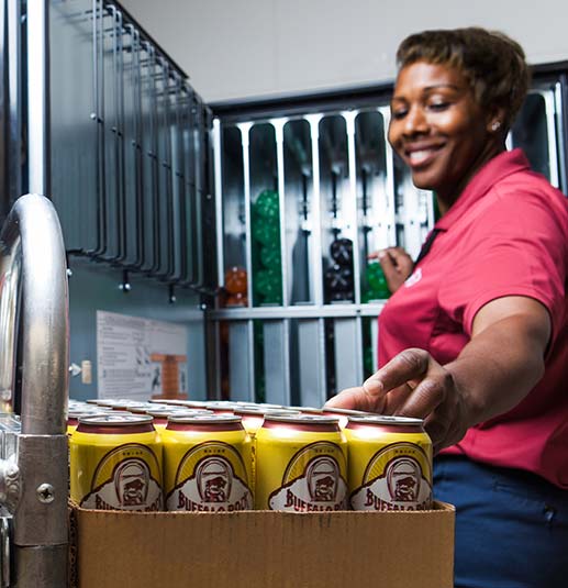 Woman Servicing Vending Machine